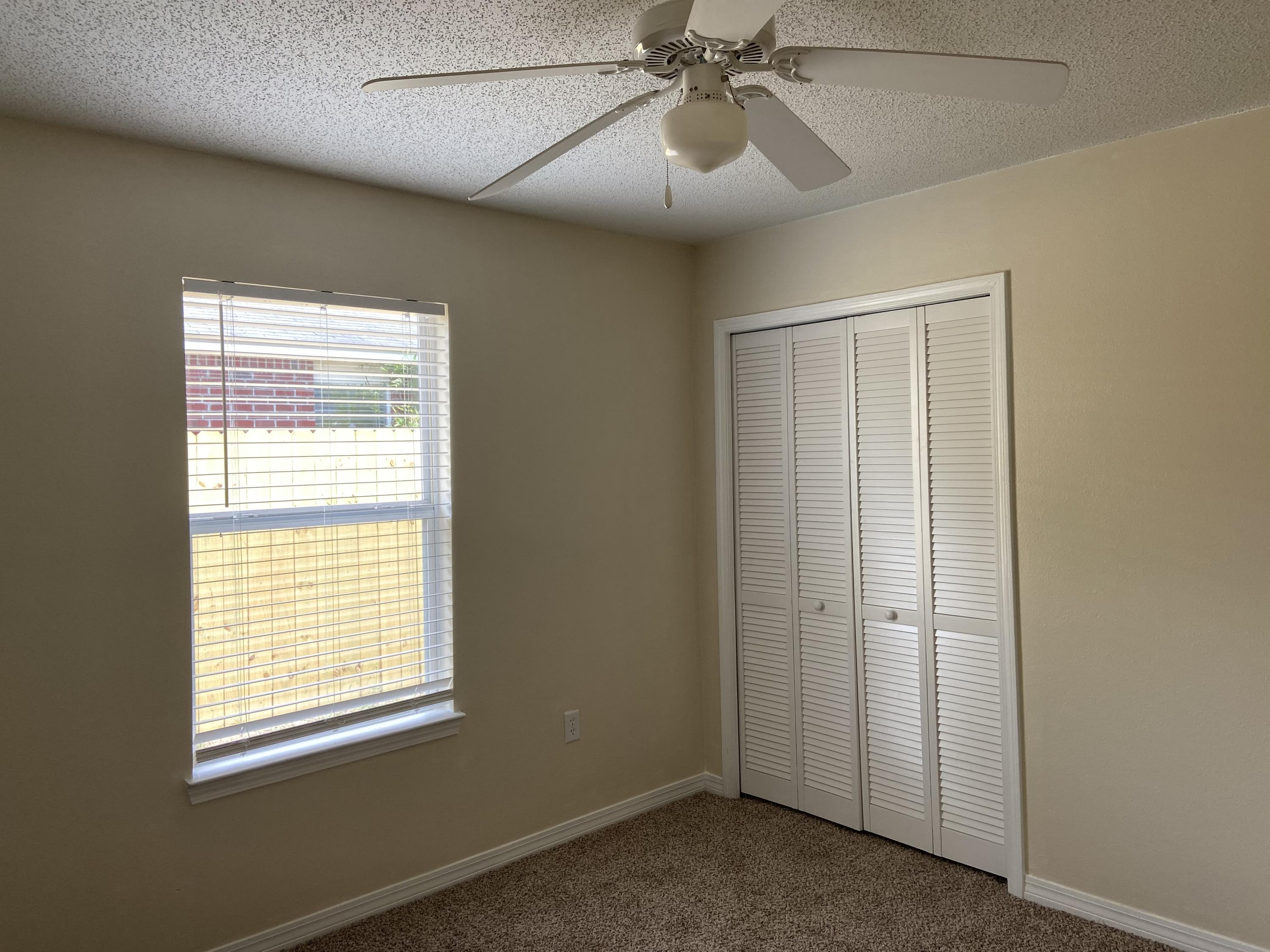 239 Limestone Circle Crestview, FL 32539 - Photo 10 of 15 a view of an empty room with a window