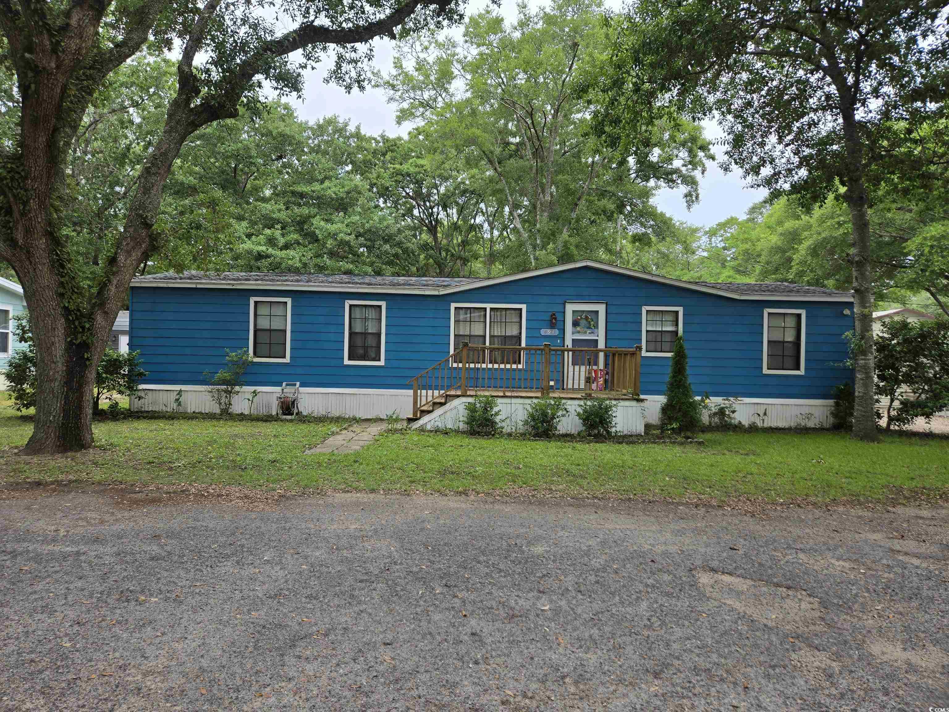 494 Clubhouse Road Murrells Inlet, SC 29576 - Photo 1 of 26 Manufactured / mobile home featuring a front lawn