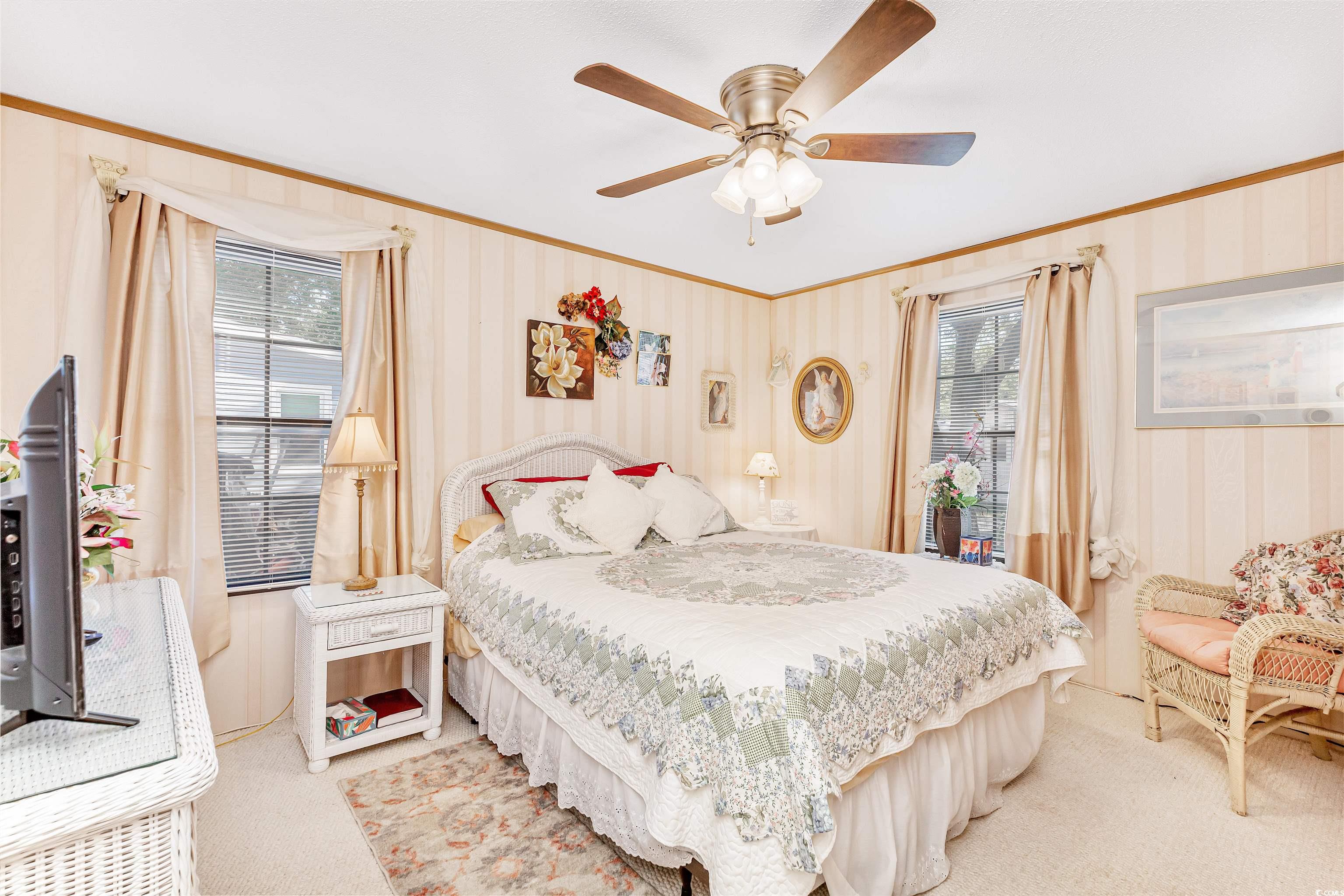 494 Clubhouse Road Murrells Inlet, SC 29576 - Photo 20 of 26 Bedroom featuring carpet floors, ornamental molding, wallpapered walls, and ceiling fan