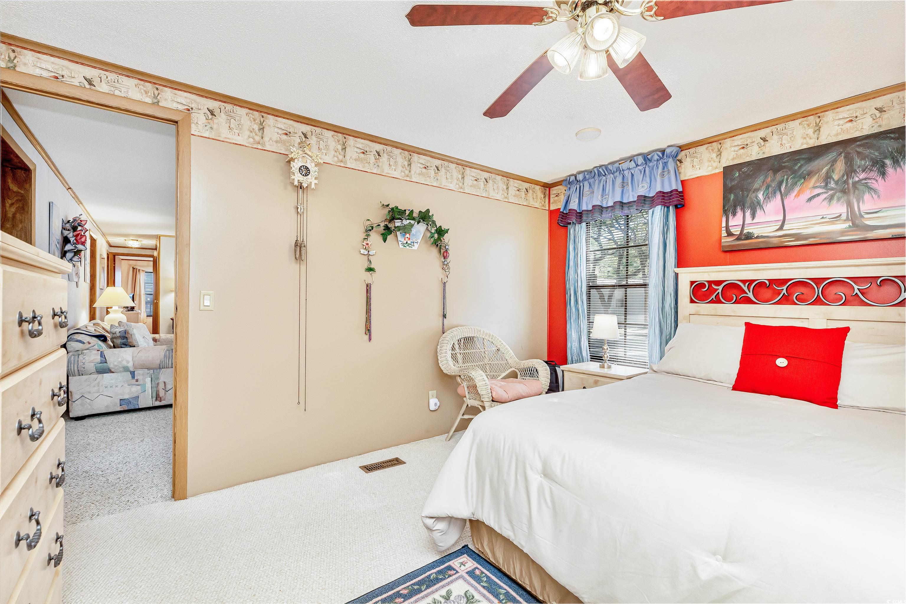 494 Clubhouse Road Murrells Inlet, SC 29576 - Photo 21 of 26 Carpeted bedroom with a ceiling fan and crown molding