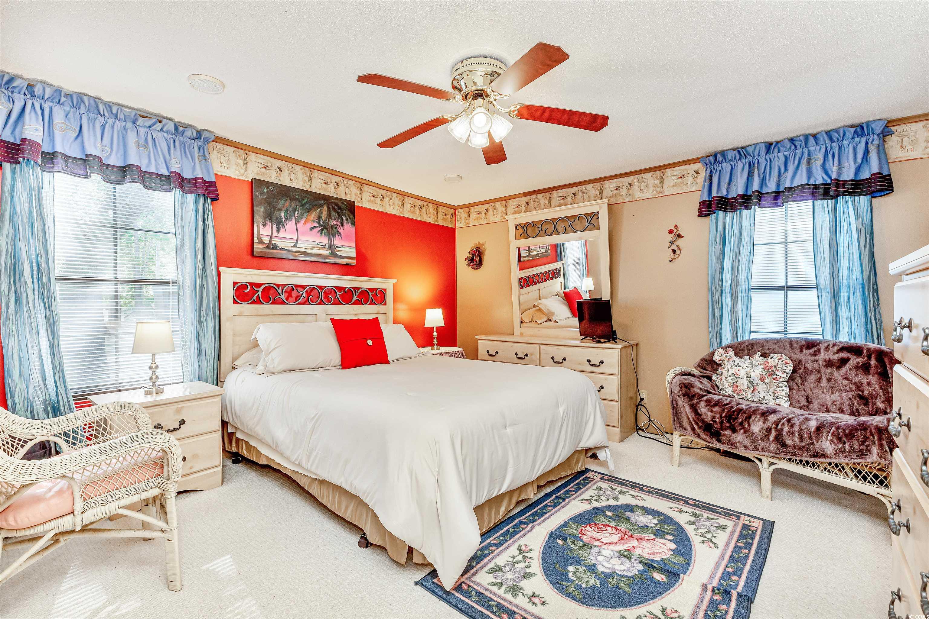 494 Clubhouse Road Murrells Inlet, SC 29576 - Photo 22 of 26 Bedroom with multiple windows, carpet, a ceiling fan, and ornamental molding