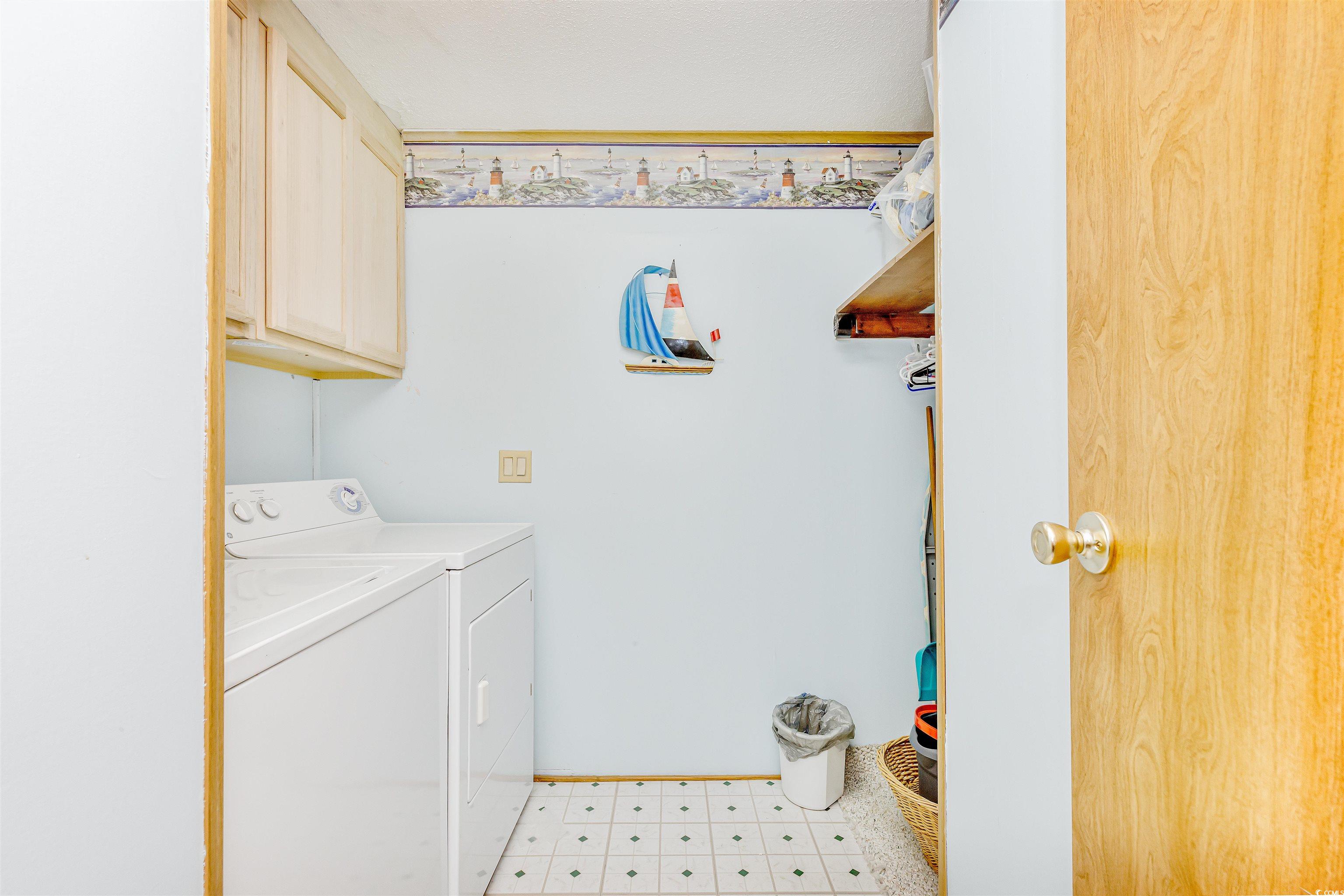494 Clubhouse Road Murrells Inlet, SC 29576 - Photo 26 of 26 Laundry area featuring cabinet space, independent washer and dryer, and baseboards
