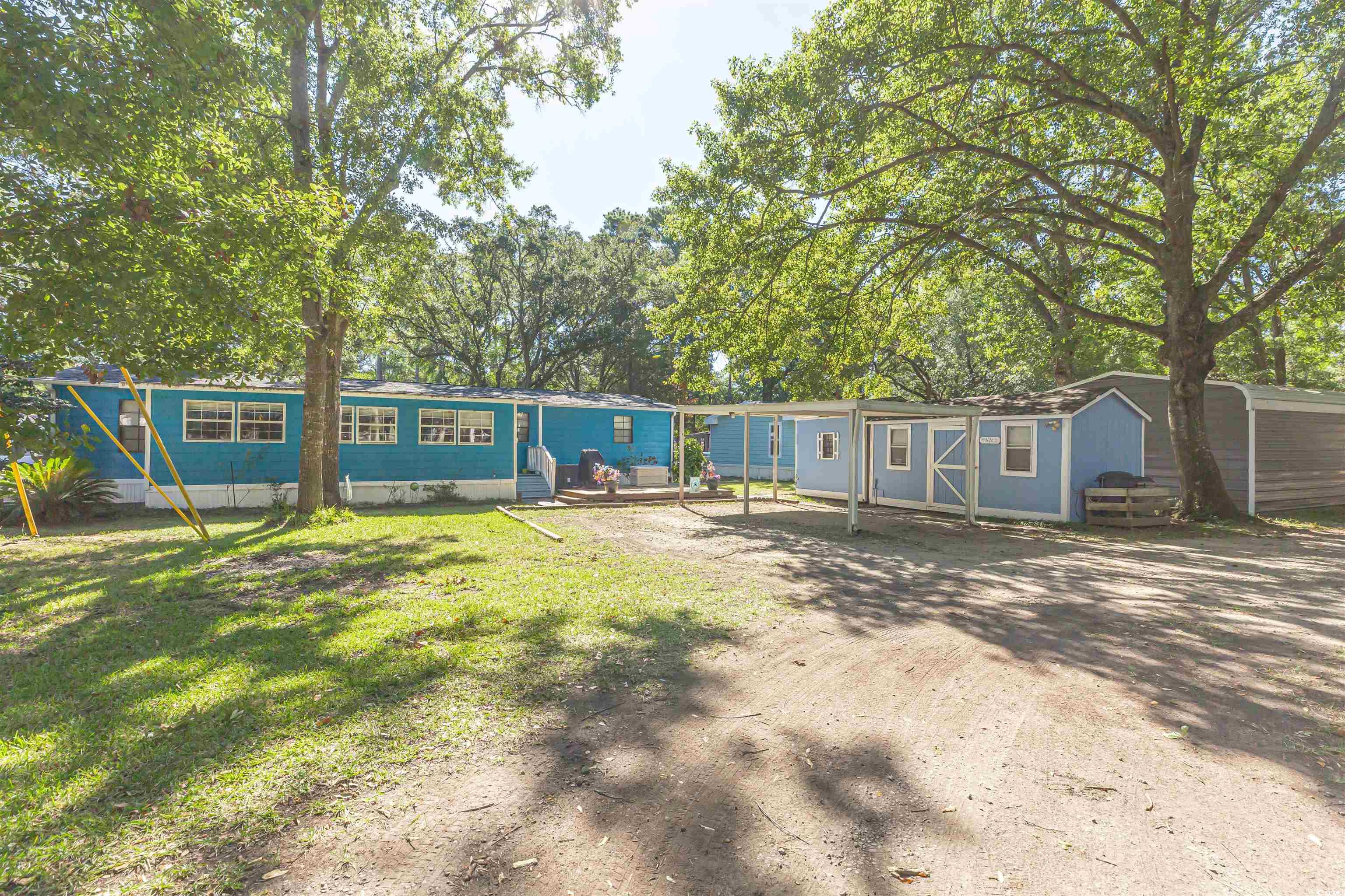 494 Clubhouse Road Murrells Inlet, SC 29576 - Photo 3 of 26 Manufactured / mobile home featuring a front lawn