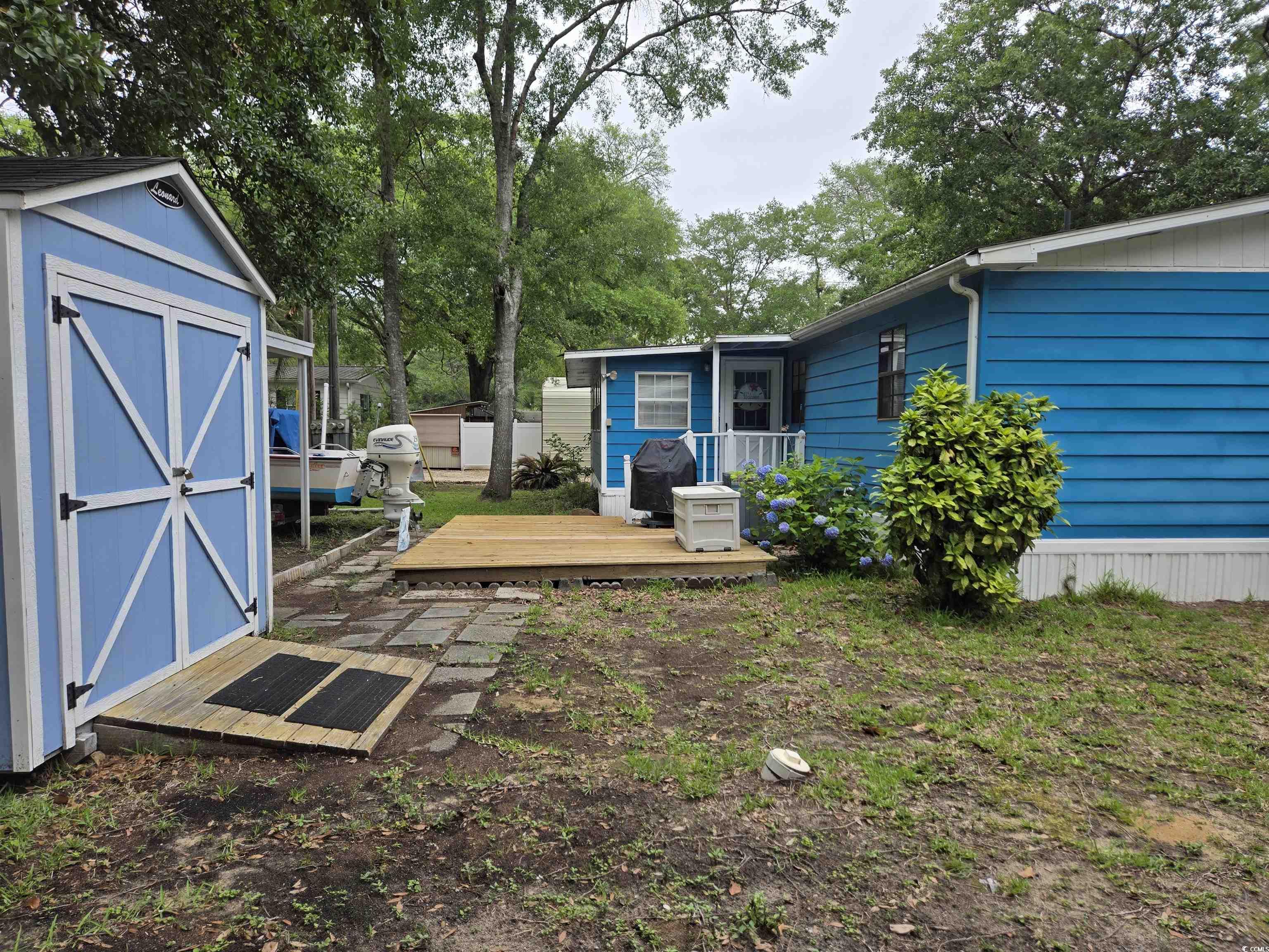 494 Clubhouse Road Murrells Inlet, SC 29576 - Photo 6 of 26 View of yard featuring a deck