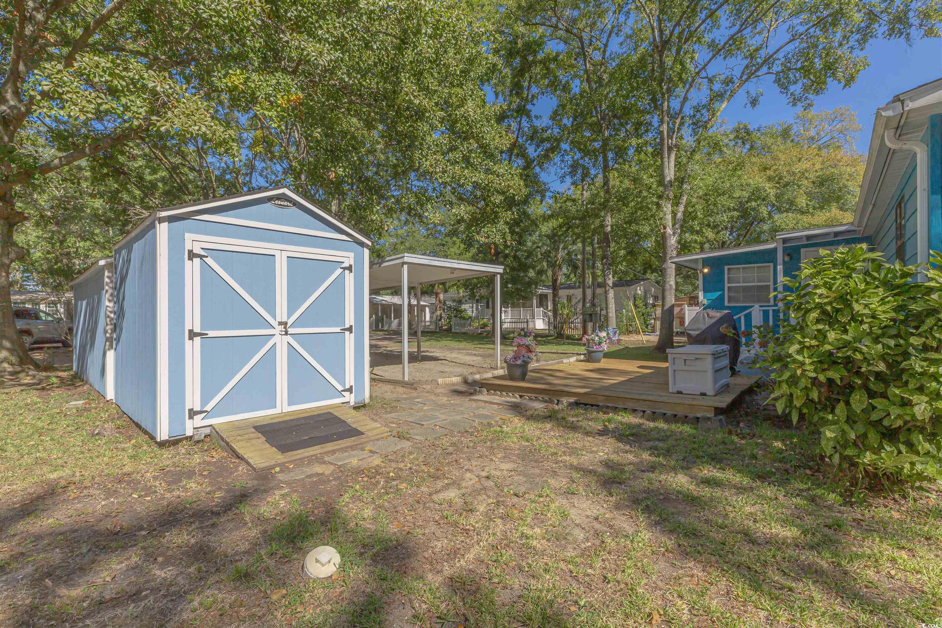 494 Clubhouse Road Murrells Inlet, SC 29576 - Photo 8 of 26 View of yard featuring a deck