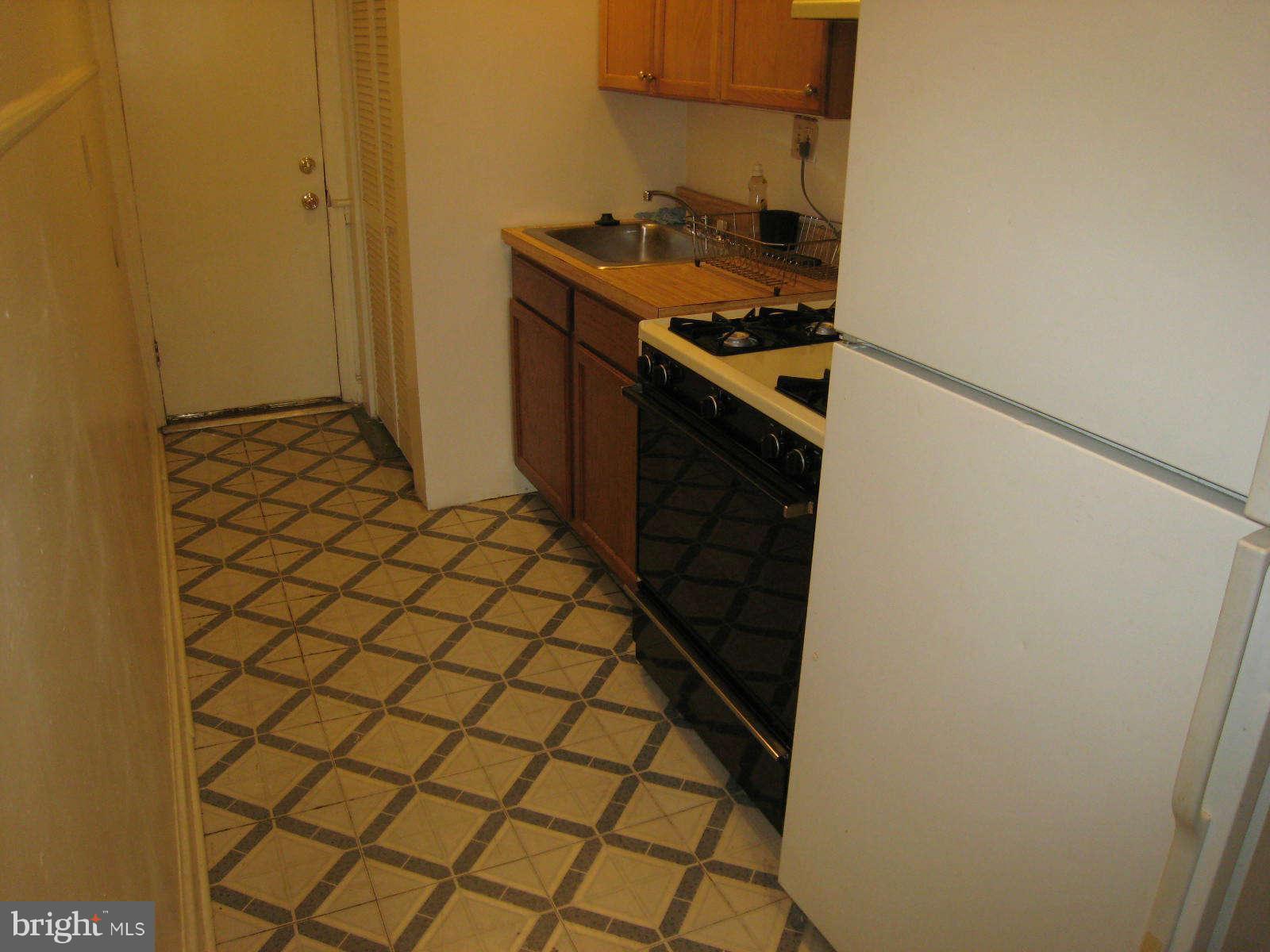 1938 I Street Northeast Washington, DC 20002 - Photo 16 of 18 a kitchen with a stove