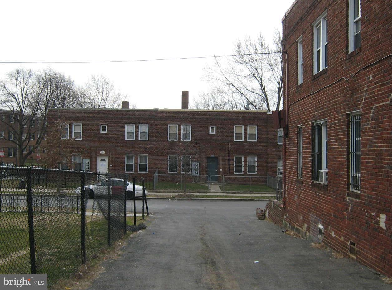 1938 I Street Northeast Washington, DC 20002 - Photo 5 of 18 a front view of a building with table and chairs
