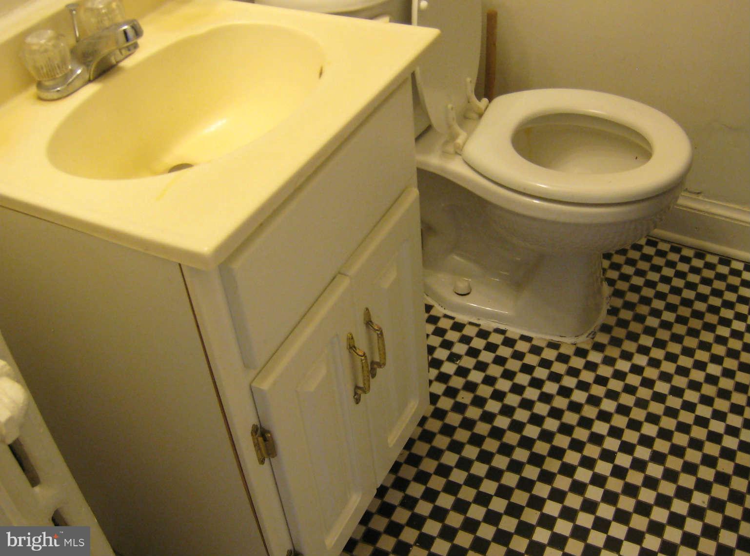1938 I Street Northeast Washington, DC 20002 - Photo 9 of 18 a bathroom with a sink and a mirror