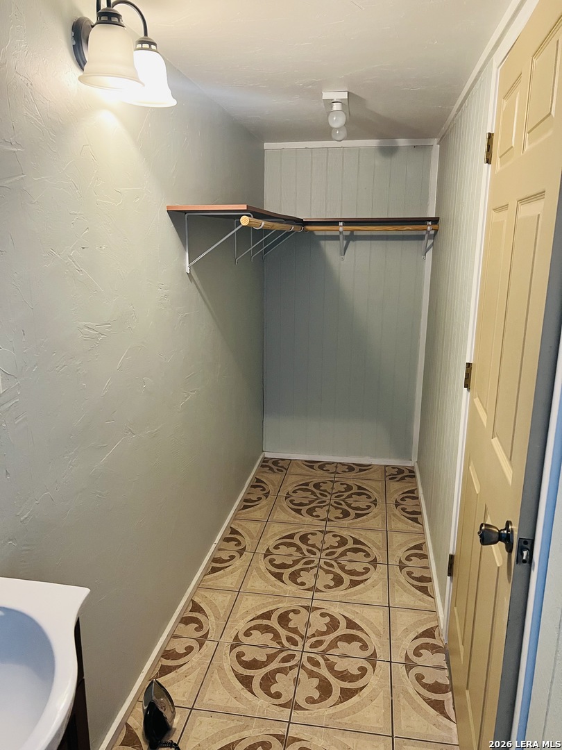 552 Diaz Street Uvalde, TX 78801 - Photo 8 of 14 a bathroom with a shower and a sink