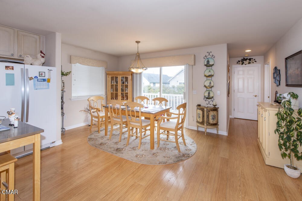 970 Glass Beach Drive Fort Bragg, CA 95437 - Photo 11 of 26 a view of a dining room with furniture and wooden floor