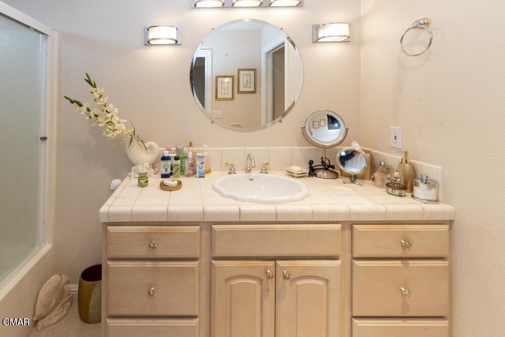 970 Glass Beach Drive Fort Bragg, CA 95437 - Photo 17 of 26 a bathroom with a sink and a mirror