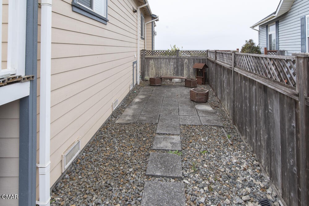 970 Glass Beach Drive Fort Bragg, CA 95437 - Photo 22 of 26 a view of a balcony with wooden floor and city view