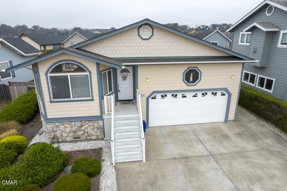 970 Glass Beach Drive Fort Bragg, CA 95437 - Photo 3 of 26 a front view of a house with garden
