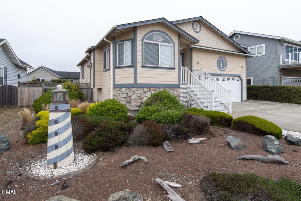 970 Glass Beach Drive Fort Bragg, CA 95437 - Photo 6 of 26 a front view of a house with garden
