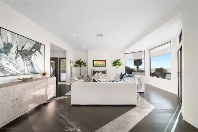 a living room with furniture rug and window