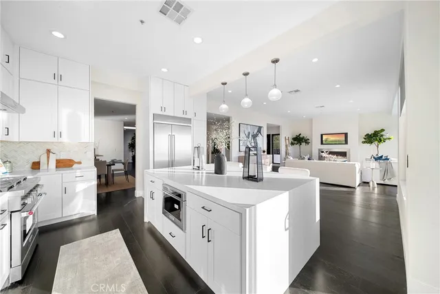 a bathroom with a double vanity sink mirror and bathtub