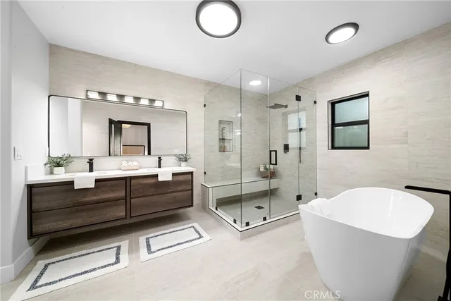a en suite bathroom with a sink and a mirror