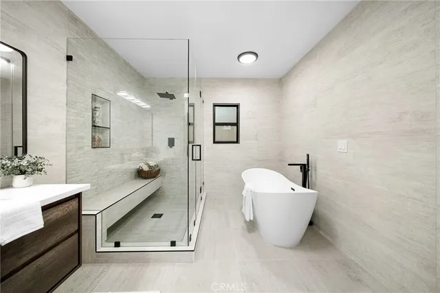a bathroom with a glass shower door