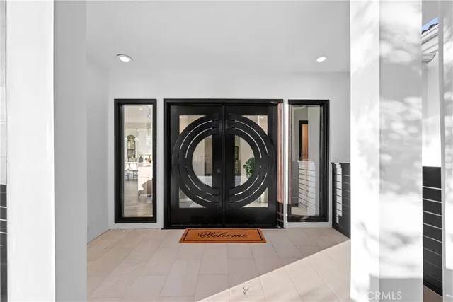 a view of a living room and a large window