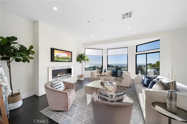 a large white kitchen with a table and chairs