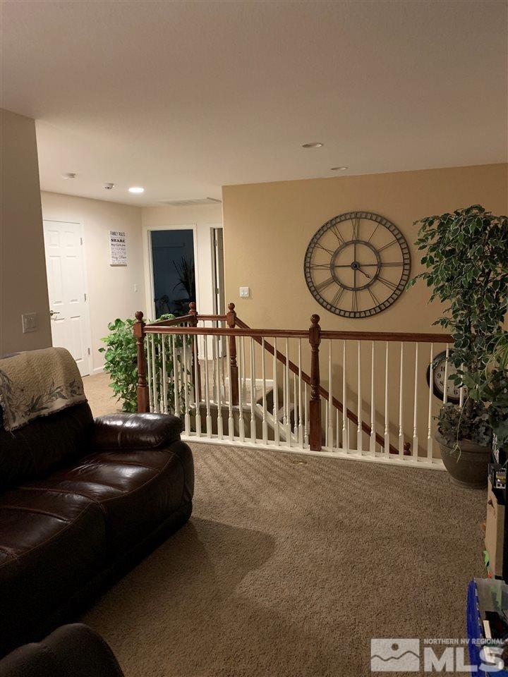 9105 Andraste Way Reno, NV 89506 - Photo 16 of 36 a living room with furniture and a flat screen tv