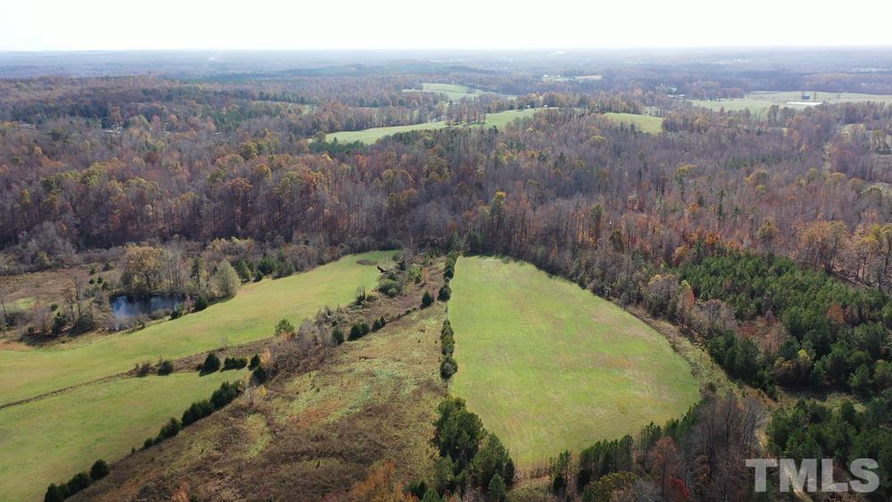 a view of a swimming pool with a yard