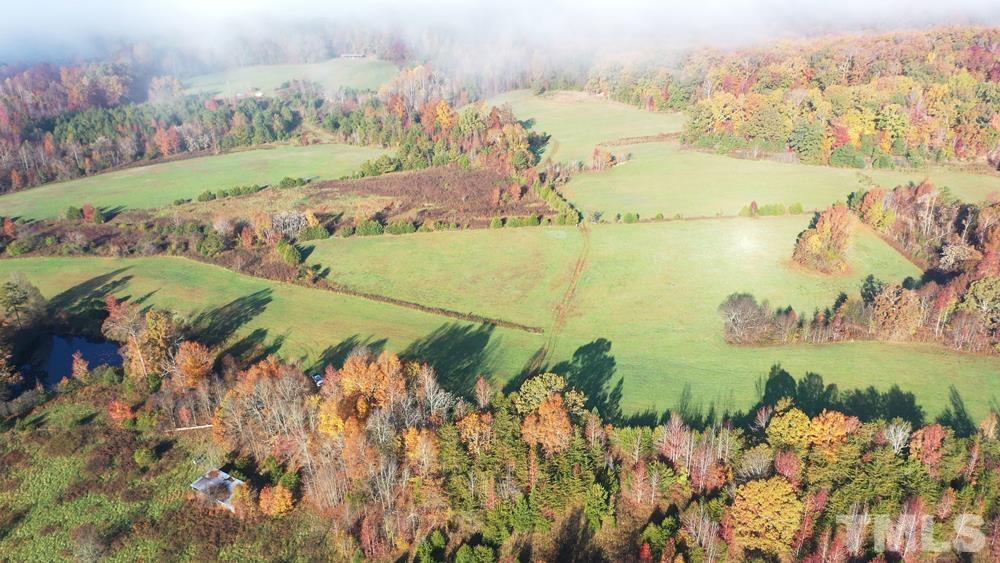 0 Fire Tower Road Snow Camp, NC 27349 - Photo 6 of 18 a view of a lake with a mountain in the background
