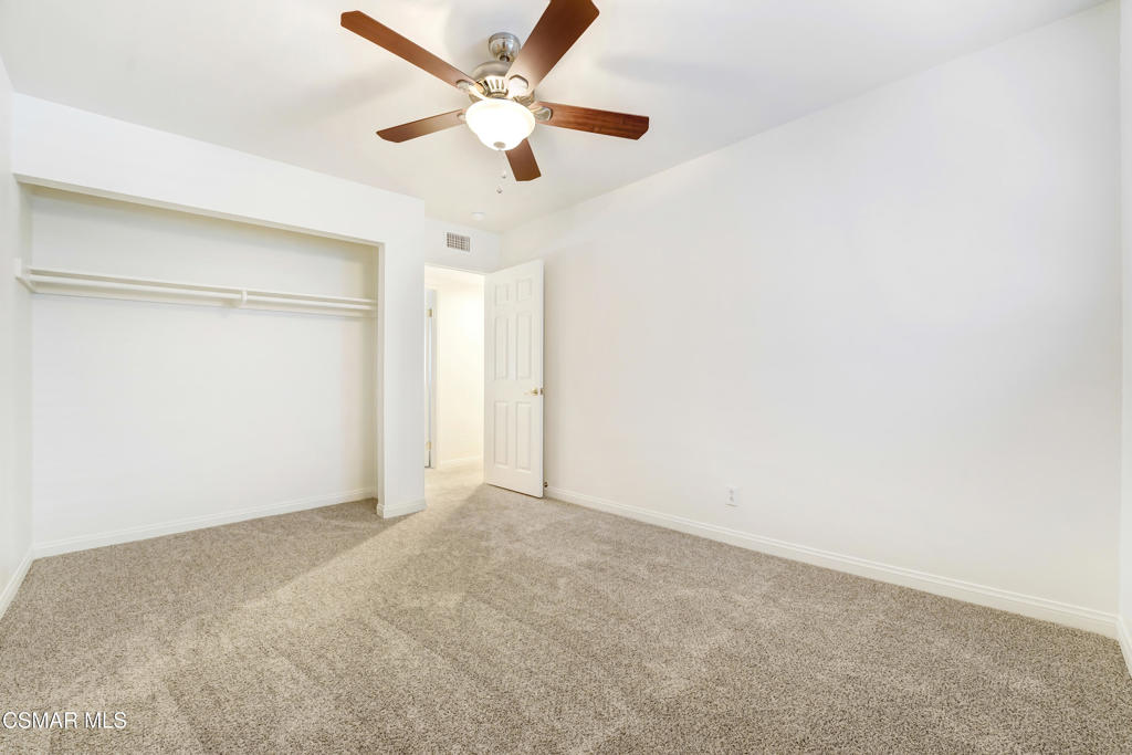 2872 Galena Avenue Simi Valley, CA 93065 - Photo 14 of 20 an empty room with a ceiling fan and a large window