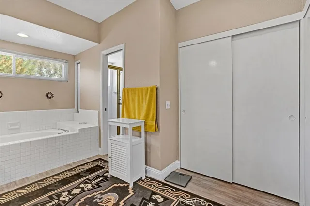 a bathroom with a tub and shower
