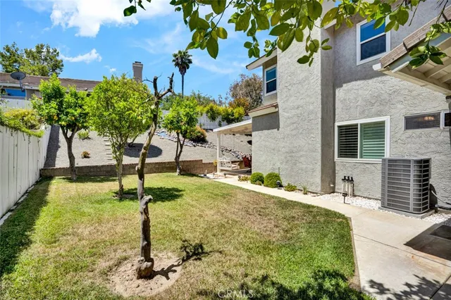 a view of a backyard with a fountain