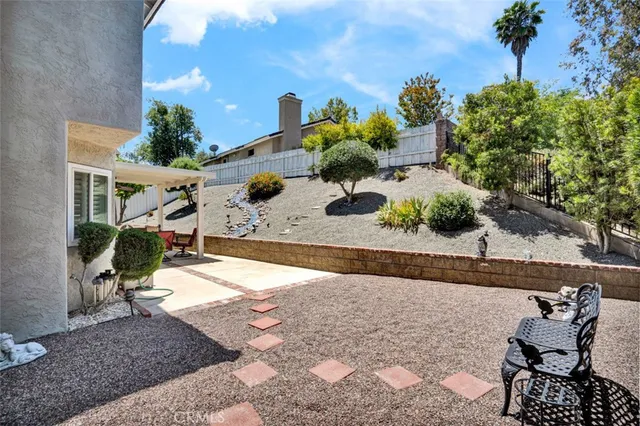a view of a backyard of the house
