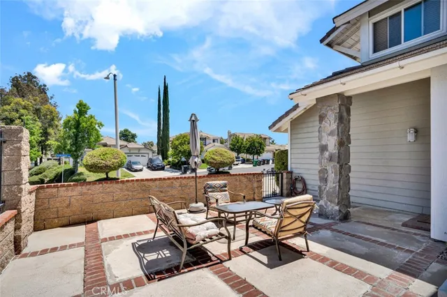 a view of backyard with sitting area