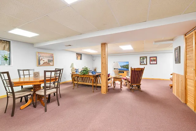 a view of a livingroom with furniture and a table