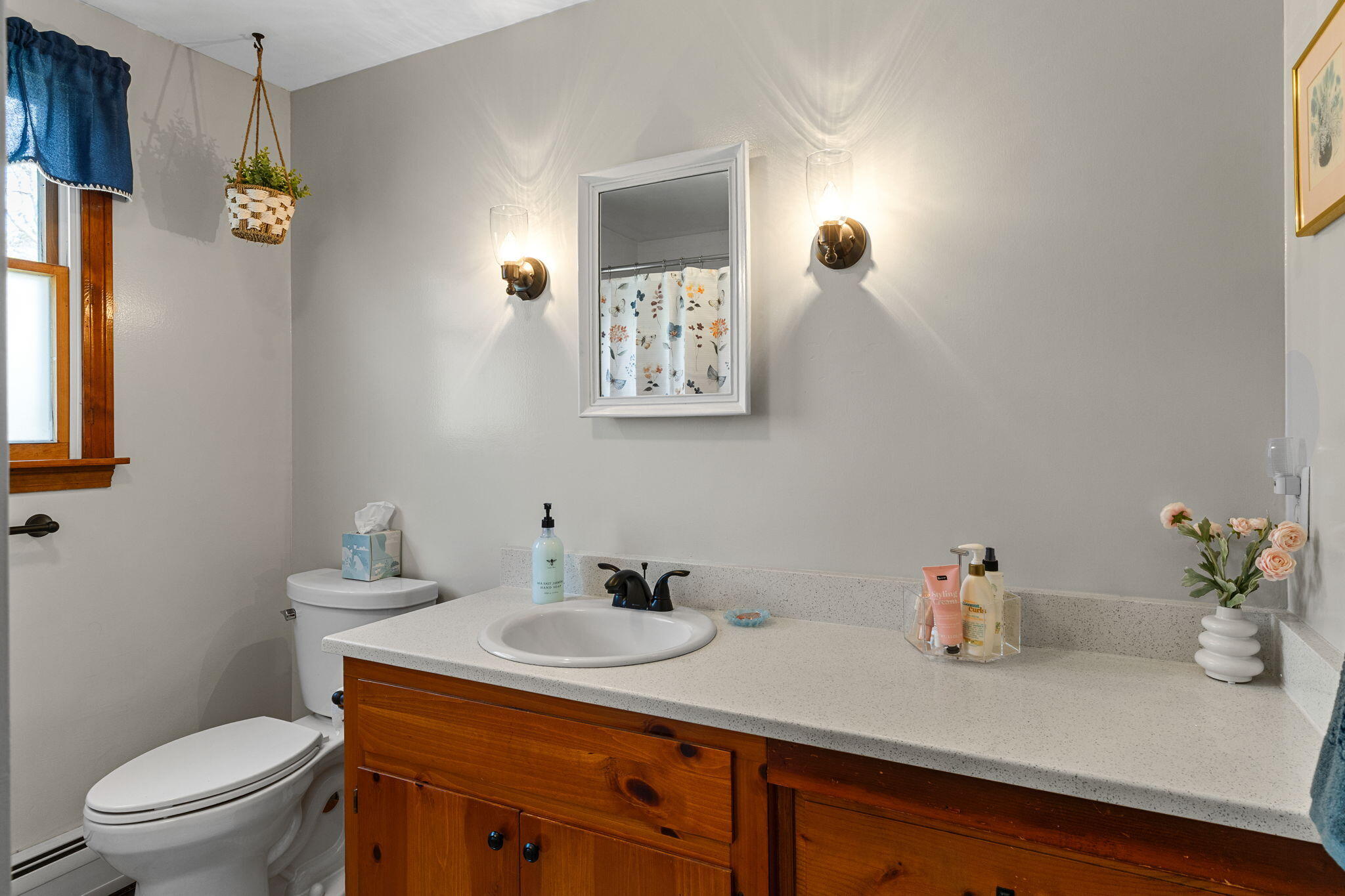 252 Chatham Road Harwich, MA 02645 - Photo 21 of 38 a bathroom with a granite countertop sink a toilet and mirror