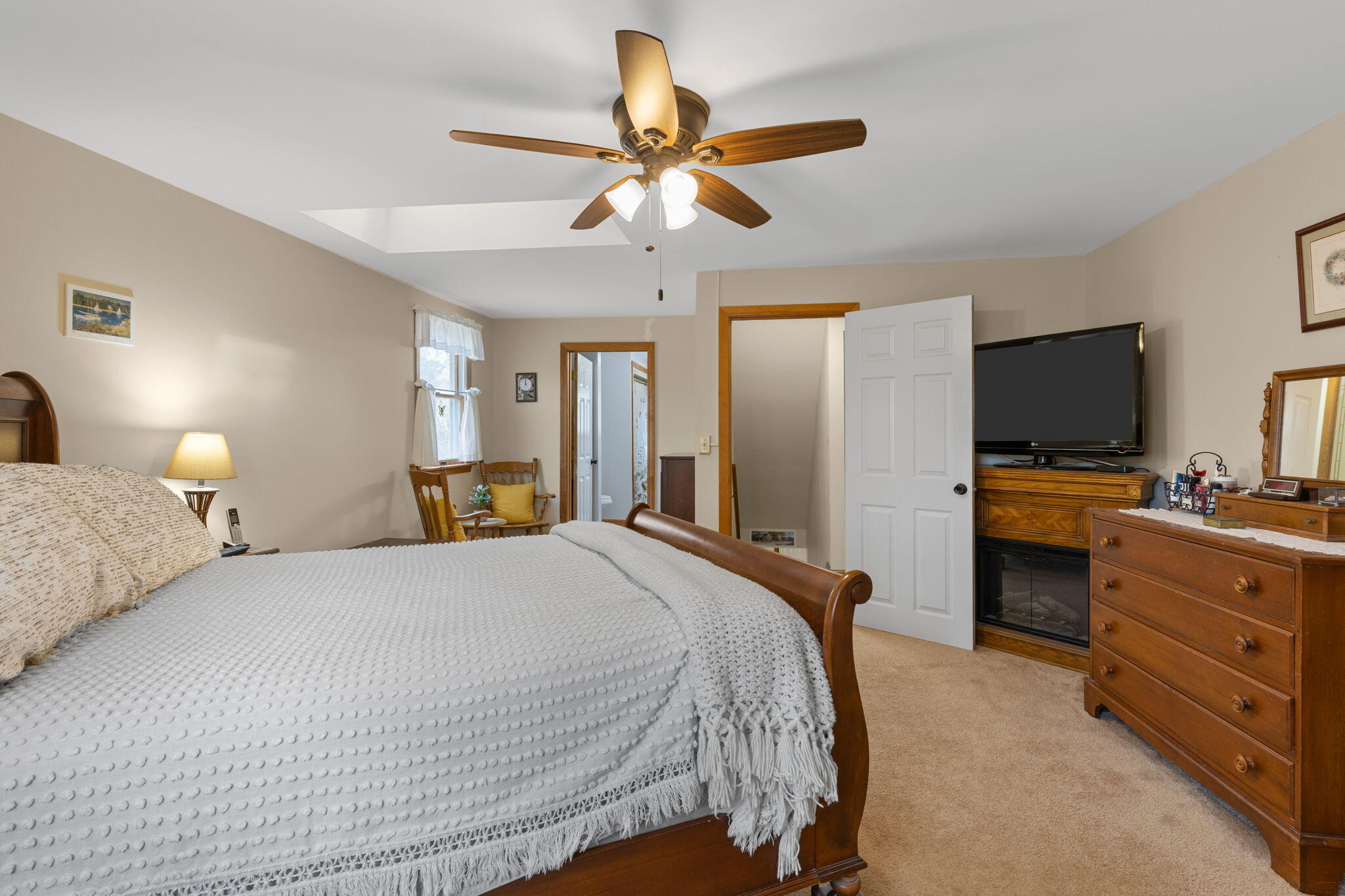 252 Chatham Road Harwich, MA 02645 - Photo 25 of 38 a bedroom with a bed and a flat screen tv