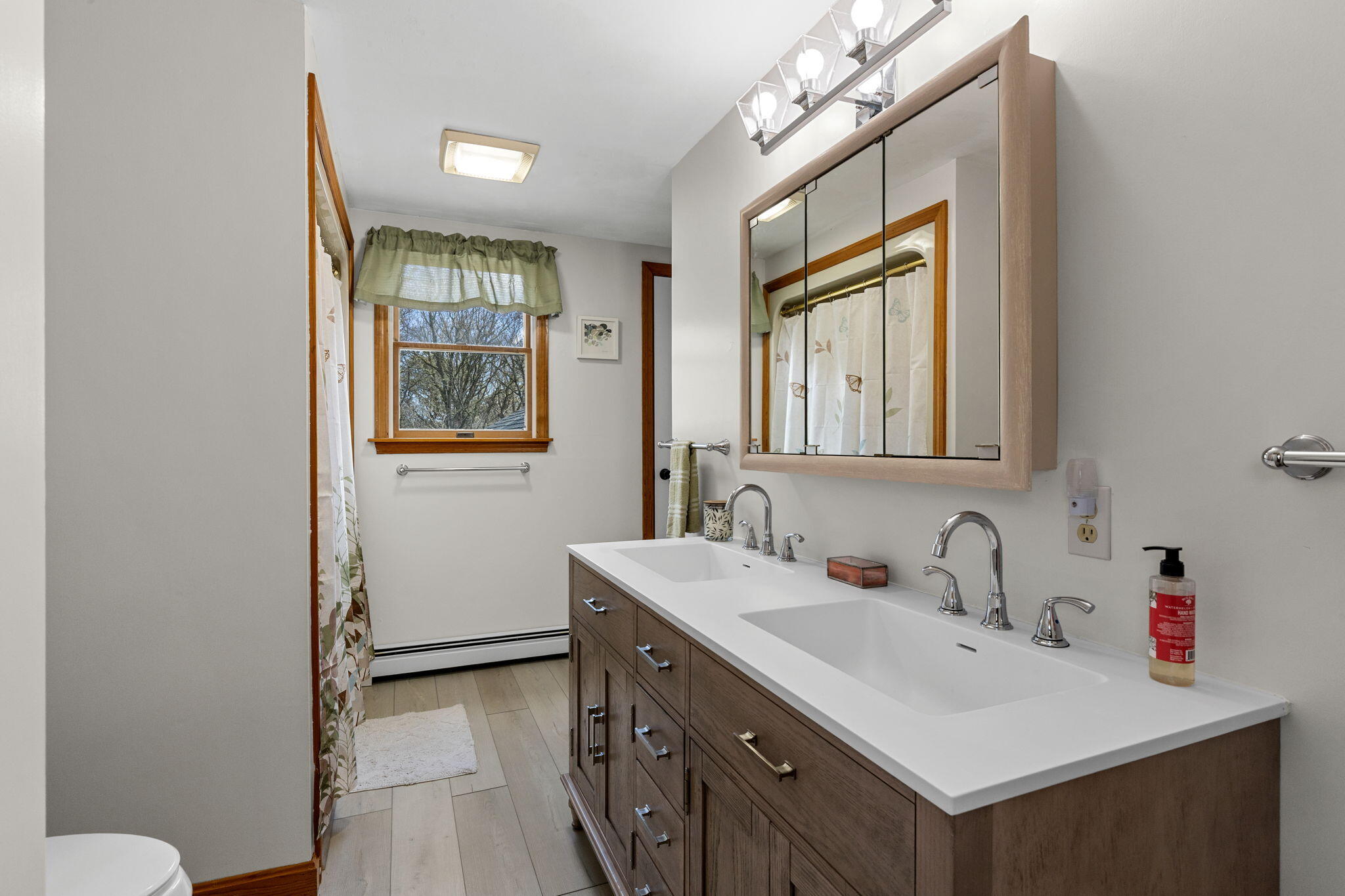 252 Chatham Road Harwich, MA 02645 - Photo 27 of 38 a bathroom with a sink vanity and a mirror