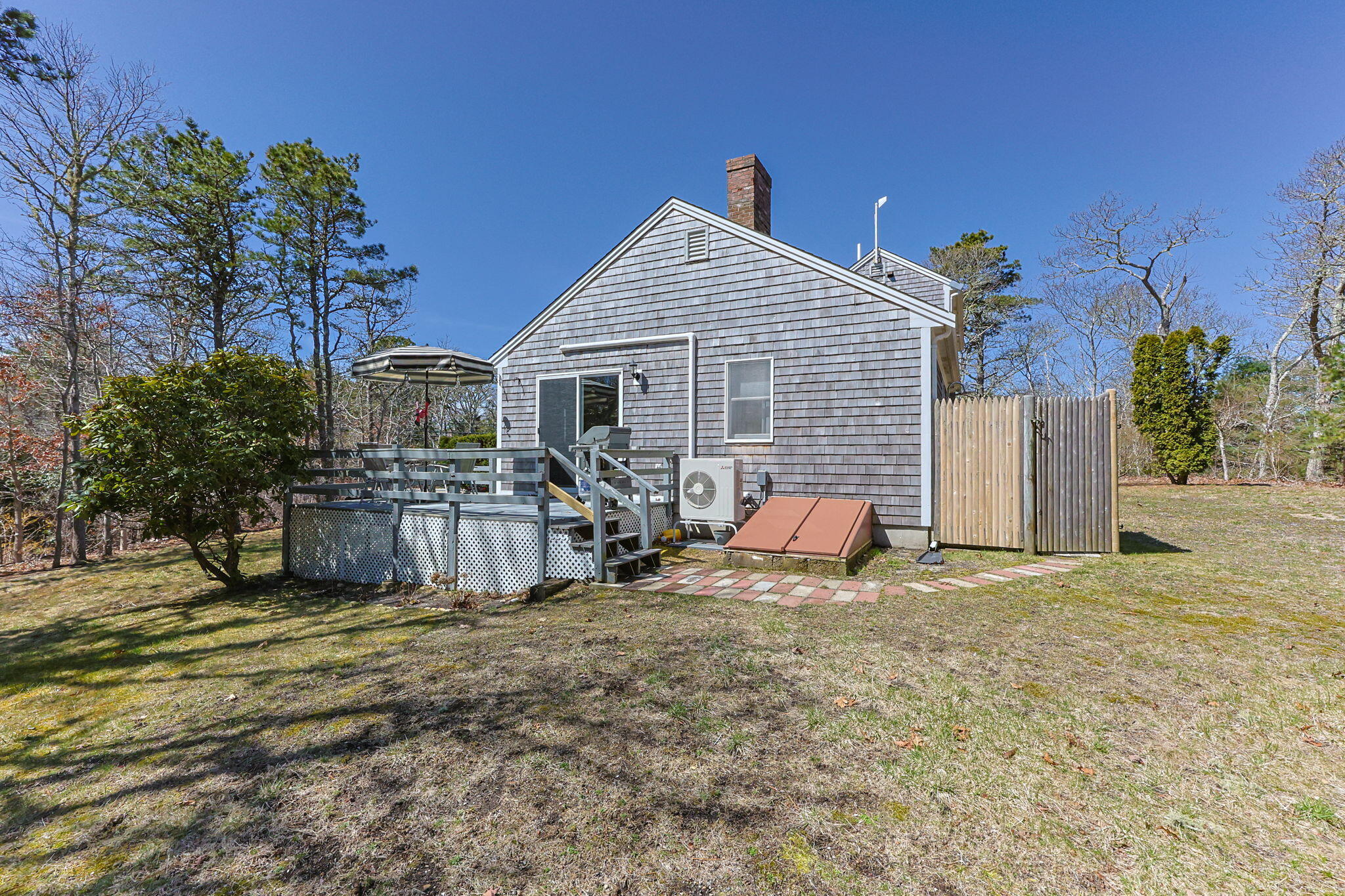252 Chatham Road Harwich, MA 02645 - Photo 3 of 38 a view of a house with large outdoor space and a car park in front of it