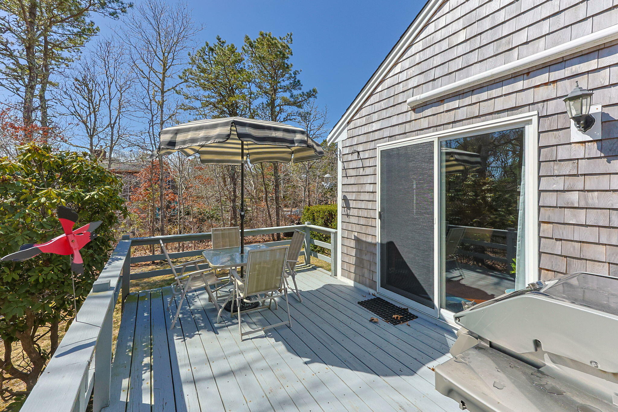 252 Chatham Road Harwich, MA 02645 - Photo 4 of 38 a view of balcony with wooden floor and outdoor seating