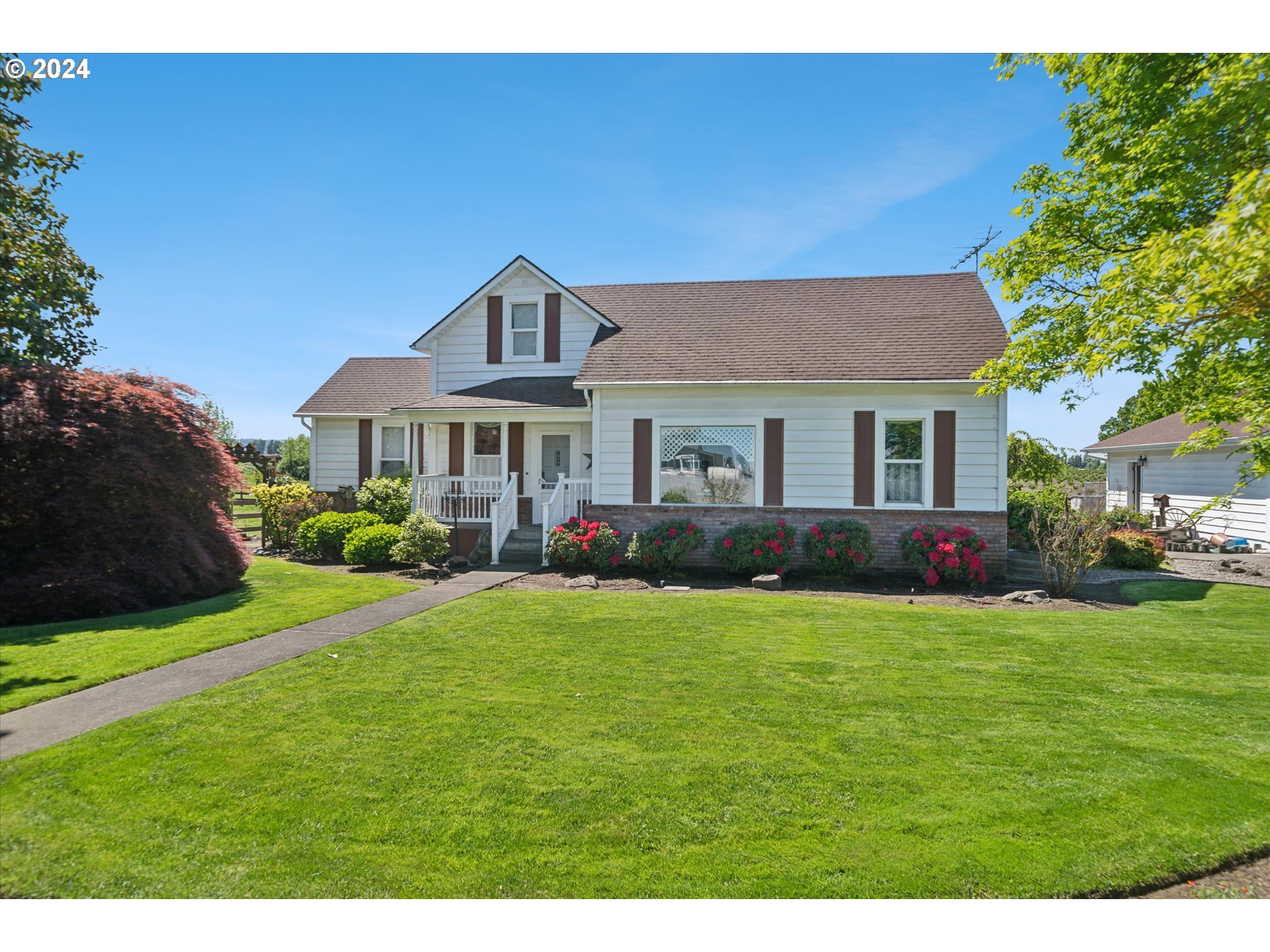 12996 Downs Road Northeast Mount Angel, OR 97362 - Photo 1 of 35 a front view of a house with a yard