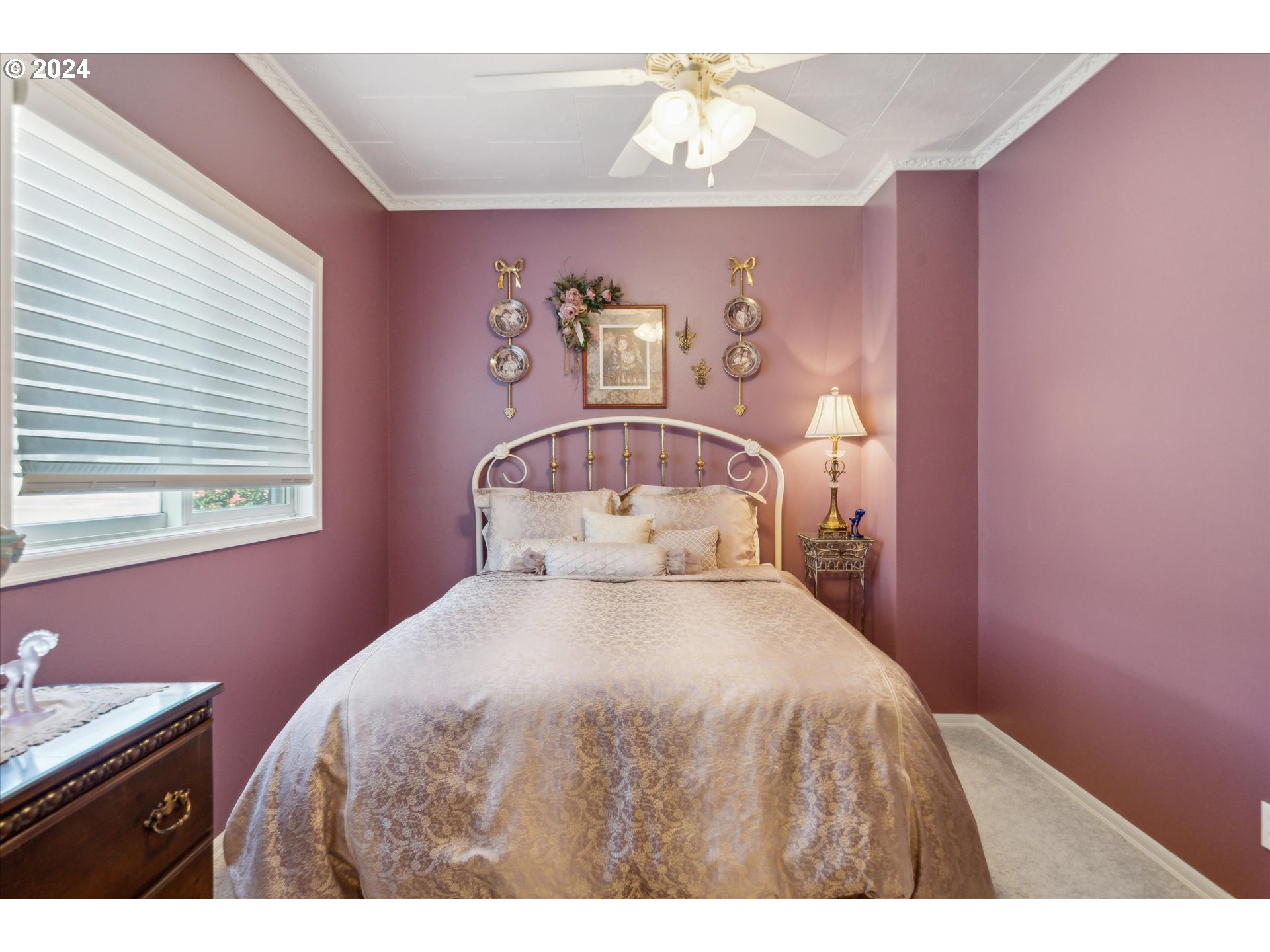 12996 Downs Road Northeast Mount Angel, OR 97362 - Photo 20 of 35 a bedroom with a bed and a chandelier