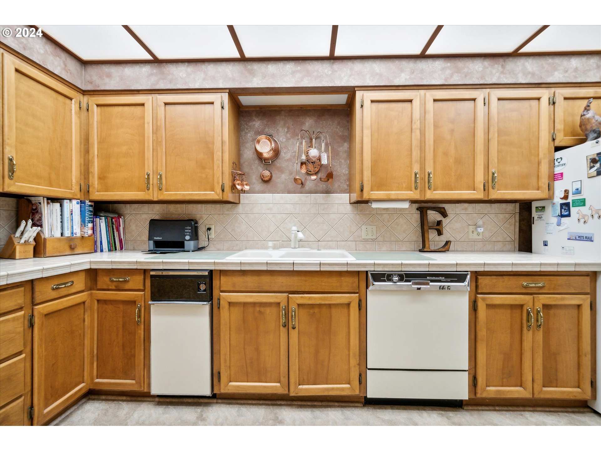 12996 Downs Road Northeast Mount Angel, OR 97362 - Photo 22 of 35 a kitchen with stainless steel appliances granite countertop a sink and cabinets