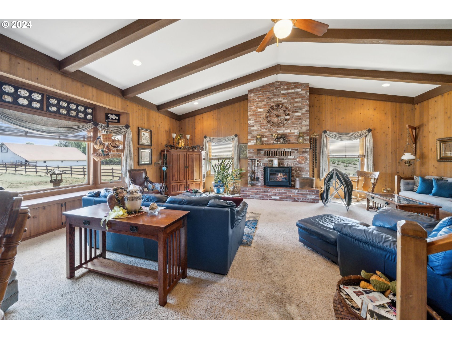 12996 Downs Road Northeast Mount Angel, OR 97362 - Photo 23 of 35 a living room with fireplace furniture and a large window