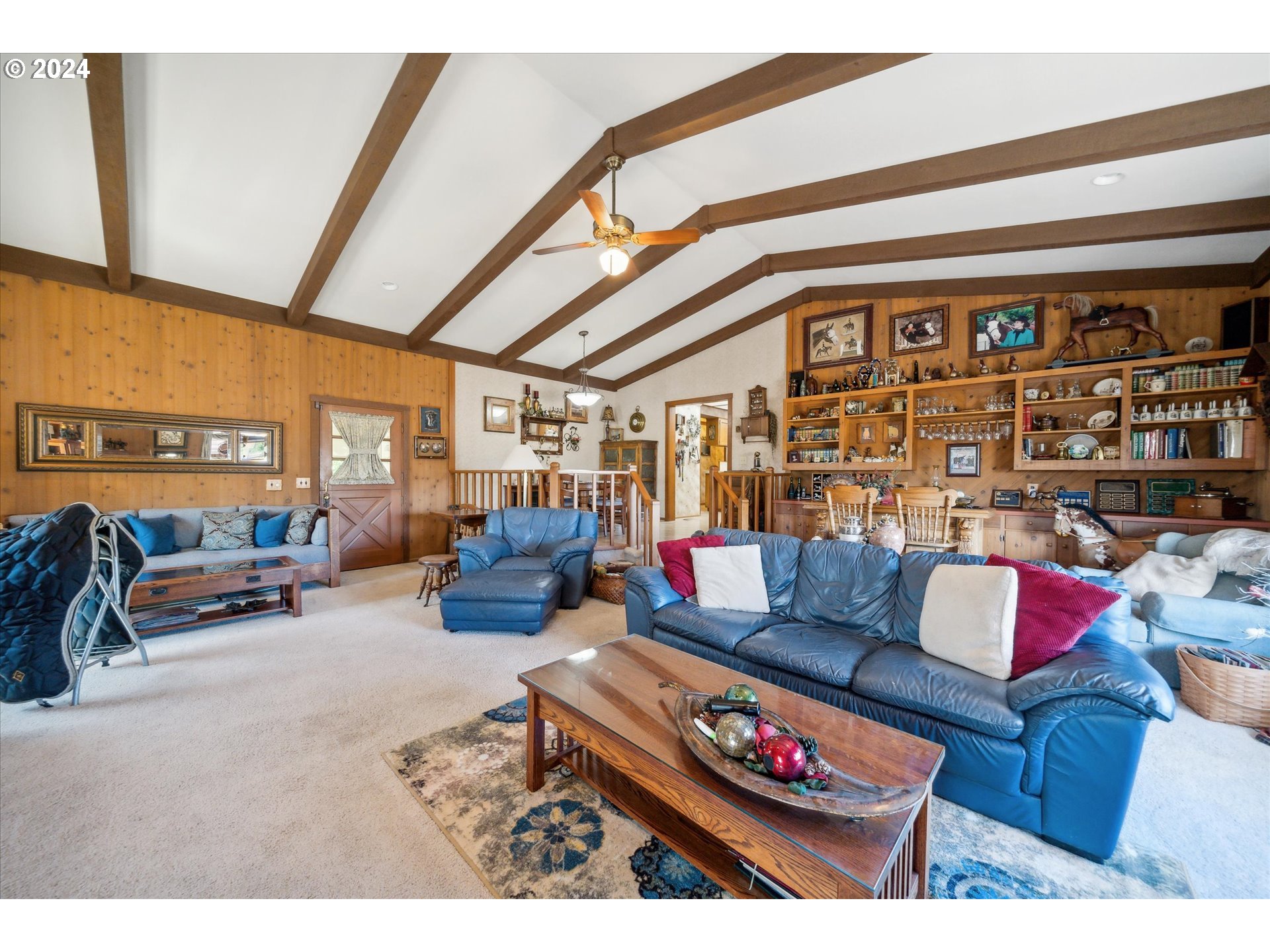 12996 Downs Road Northeast Mount Angel, OR 97362 - Photo 24 of 35 a living room with furniture a couch and a floor to ceiling window