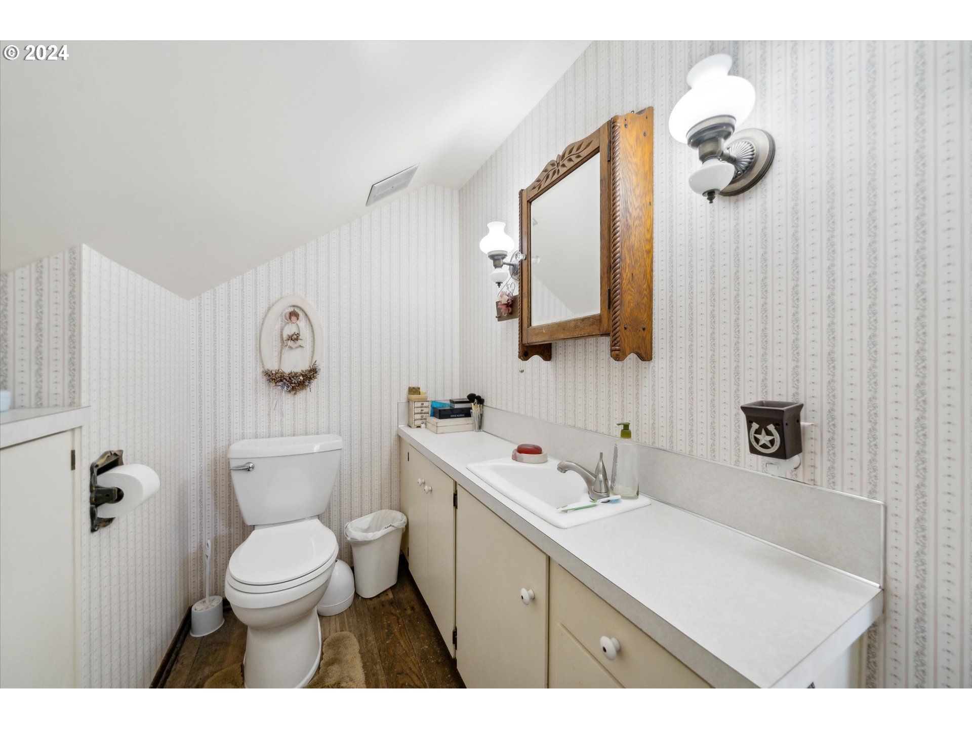 12996 Downs Road Northeast Mount Angel, OR 97362 - Photo 34 of 35 a bathroom with a sink a toilet and mirror