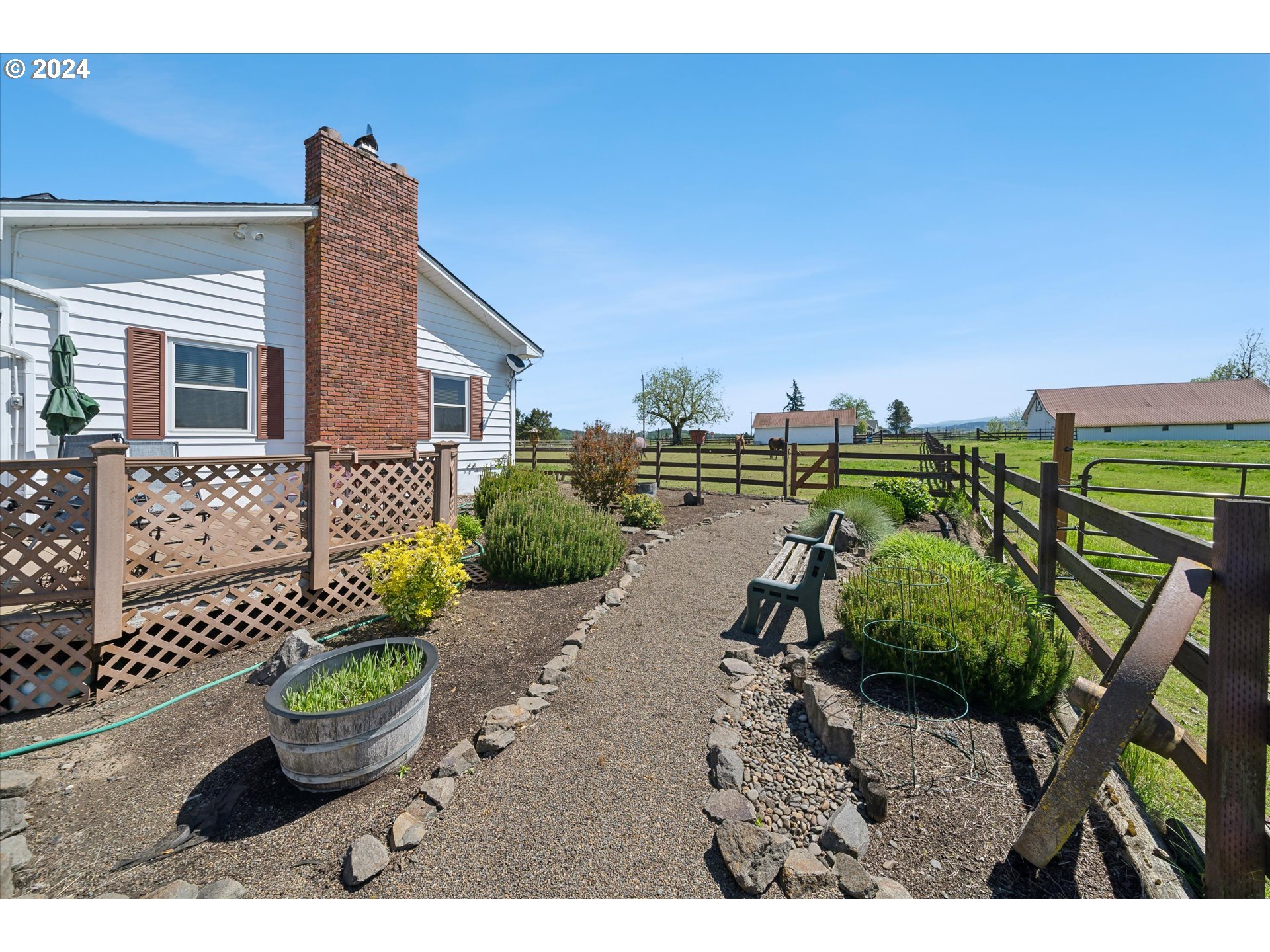 12996 Downs Road Northeast Mount Angel, OR 97362 - Photo 5 of 35 a view of a backyard with couches potted plants and sky view