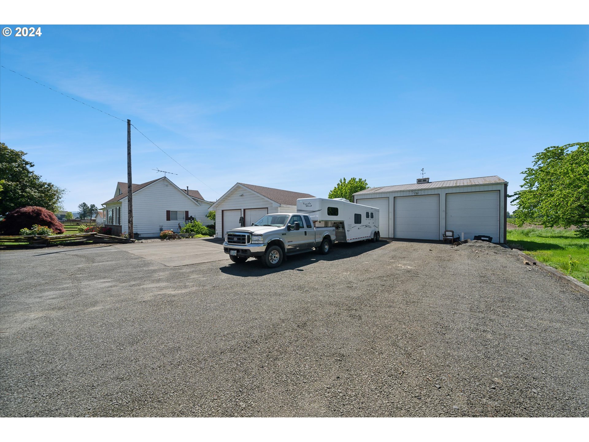 12996 Downs Road Northeast Mount Angel, OR 97362 - Photo 8 of 35 a house view with a car parked in front of it