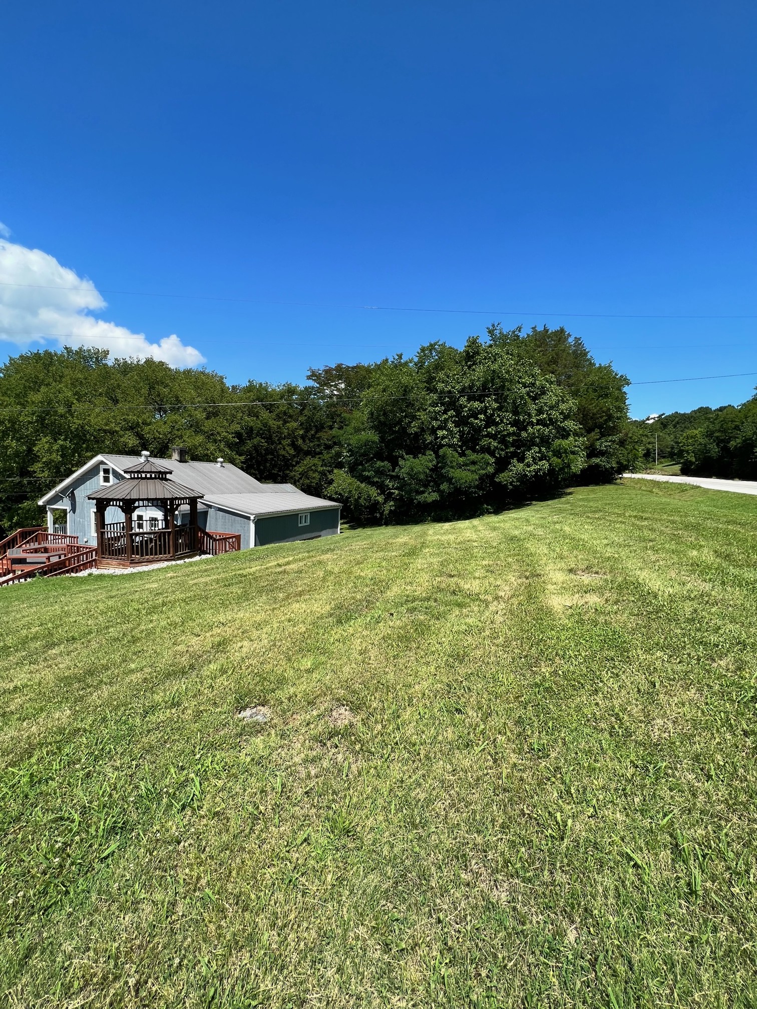 10 Alexander Road Riddleton, TN 37151 - Photo 32 of 37 a view of a lake with a yard