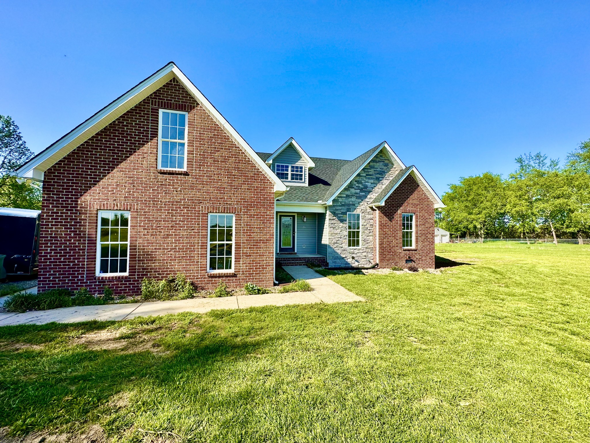 216 Clubbs Road Portland, TN 37148 - Photo 1 of 14 a front view of house with yard and green space