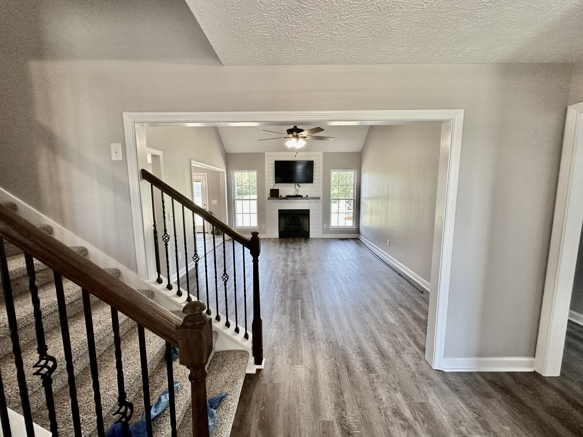 216 Clubbs Road Portland, TN 37148 - Photo 2 of 14 a view of a hallway view with wooden floor and staircase