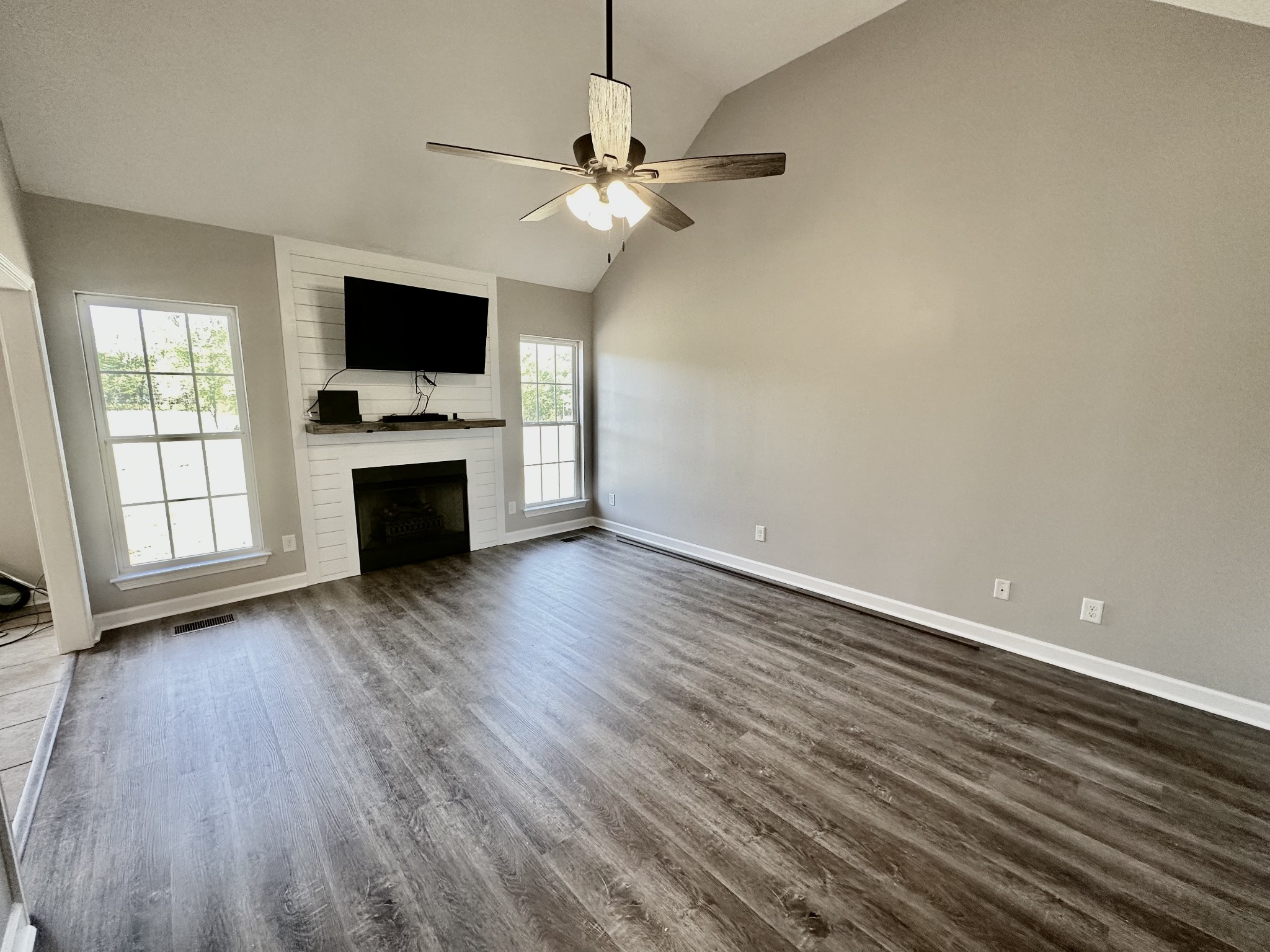 216 Clubbs Road Portland, TN 37148 - Photo 3 of 14 a view of empty room with wooden floor and fan